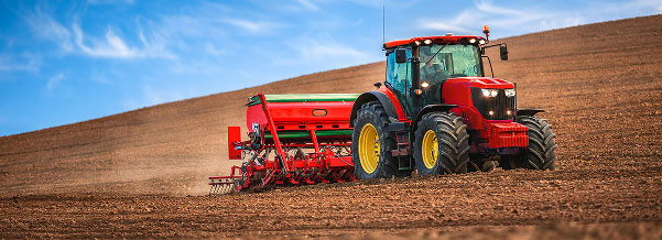Tractor plowing field