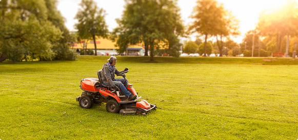 person mowing lawn