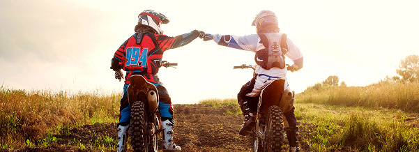 two bikers fist bumping