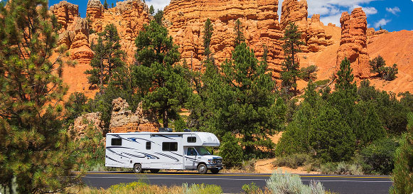 RV driving down scenic road